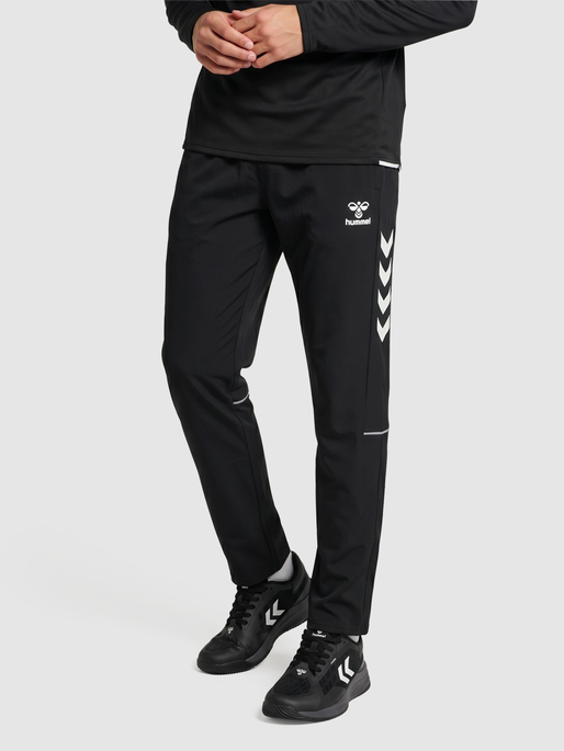hmlCORE 2.0 WOVEN PANTS, BLACK/WHITE, model